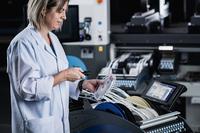 Scanning the unique code (UID) of a component reel on a Europlacer feeder for optimum stock management.